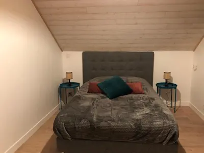 Un ou plusieurs lits dans un hébergement de l'établissement Maisonnette au cœur du vignoble