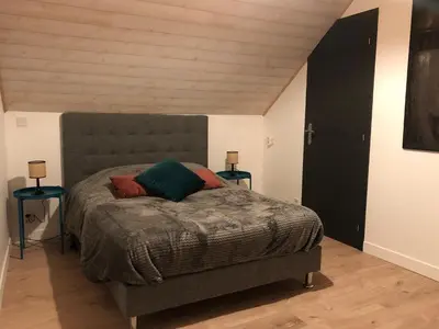 Un ou plusieurs lits dans un hébergement de l'établissement Maisonnette au cœur du vignoble