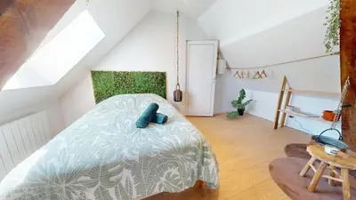 Un ou plusieurs lits dans un hébergement de l'établissement Appartement de Charme