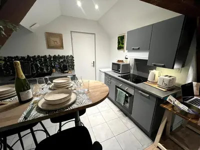 Cuisine ou kitchenette dans l'établissement Appartement de Charme