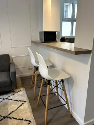 Télévision ou salle de divertissement dans l'établissement Le petit Paris Compiegne