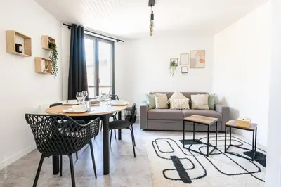 Coin salon dans l'établissement Le 27 - Appartement Cosy - Disney 15min