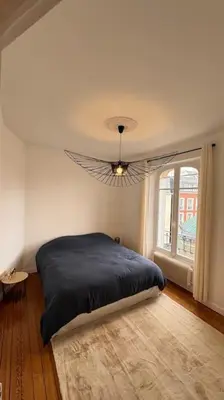 Un ou plusieurs lits dans un hébergement de l'établissement Appartement neuf au centre d'Épernay.
