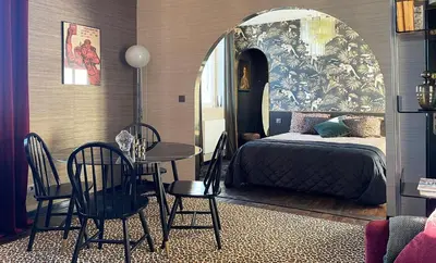 Un ou plusieurs lits dans un hébergement de l'établissement Les Alcoves - Studios design