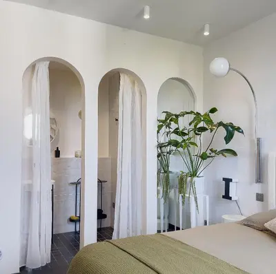 Un ou plusieurs lits dans un hébergement de l'établissement Les Alcoves - Studios design