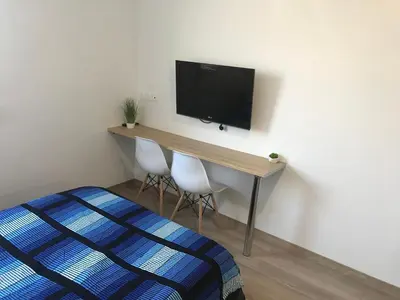 Télévision ou salle de divertissement dans l'établissement IKIZEN - Arena Confort - Boulingrin