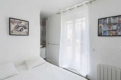Un ou plusieurs lits dans un hébergement de l'établissement Eclipsa - Appartement de charme centre-ville