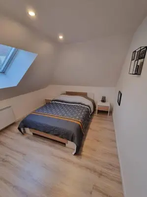 Un ou plusieurs lits dans un hébergement de l'établissement Cosy appartement proche Disneyland