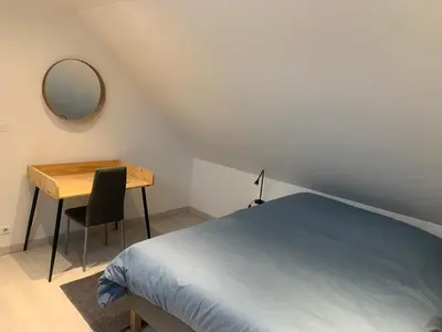 Un ou plusieurs lits dans un hébergement de l'établissement Loft au calme, idéal pour famille, proche de Reims