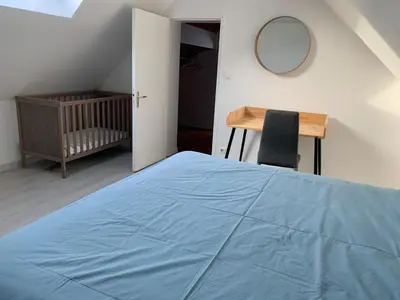 Un ou plusieurs lits dans un hébergement de l'établissement Loft au calme, idéal pour famille, proche de Reims