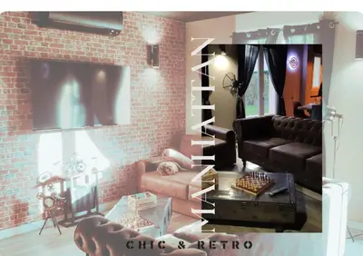 Coin salon dans l'établissement LE MANHATTAN Authentique maison climatisée 78 m2