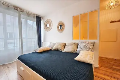 Un ou plusieurs lits dans un hébergement de l'établissement Cozy Nest Paris 25mn Disney 20mn
