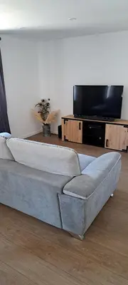Télévision ou salle de divertissement dans l'établissement Gîte des deux L
