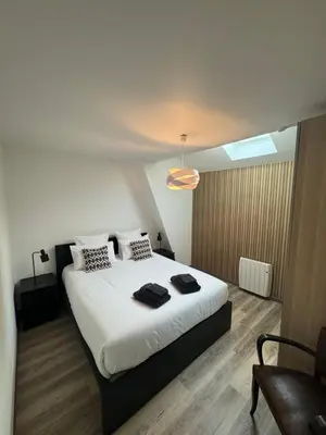 Un ou plusieurs lits dans un hébergement de l'établissement Appartement Cosy dans le coeur de Witry-les-Reims