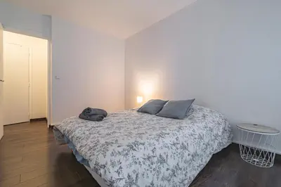 Un ou plusieurs lits dans un hébergement de l'établissement Joli appartement Le Chalet + parking