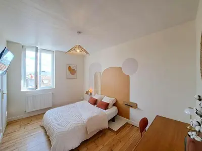 Un ou plusieurs lits dans un hébergement de l'établissement Appartement Cosy