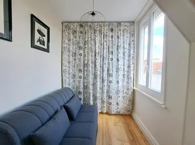 Coin salon dans l'établissement Appartement Cosy