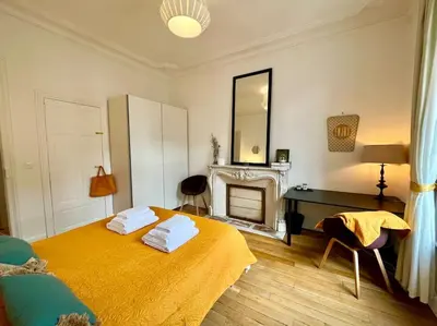 Un ou plusieurs lits dans un hébergement de l'établissement L’Hôtel Particulier des Anges