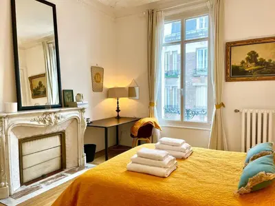 Un ou plusieurs lits dans un hébergement de l'établissement L’Hôtel Particulier des Anges