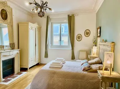 Un ou plusieurs lits dans un hébergement de l'établissement L’Hôtel Particulier des Anges