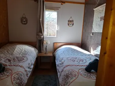 Un ou plusieurs lits dans un hébergement de l'établissement chalet tout équipé