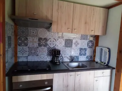 Cuisine ou kitchenette dans l'établissement chalet tout équipé
