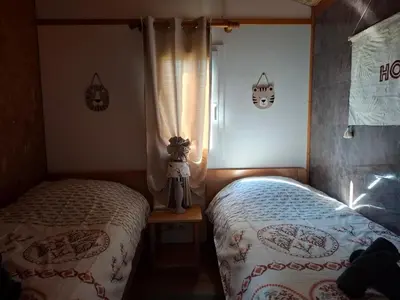 Un ou plusieurs lits dans un hébergement de l'établissement chalet tout équipé