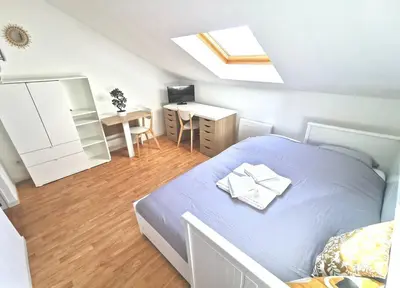 Un ou plusieurs lits dans un hébergement de l'établissement Studio cosy au cœur de Reims