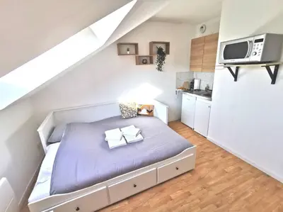Un ou plusieurs lits dans un hébergement de l'établissement Studio cosy au cœur de Reims