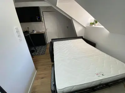 Un ou plusieurs lits dans un hébergement de l'établissement Appartement - Le cocon Rémois