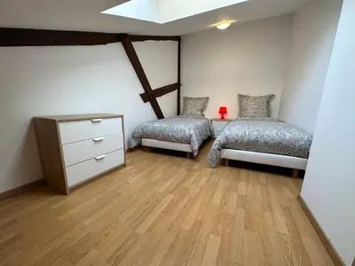 Un ou plusieurs lits dans un hébergement de l'établissement Champagne BNB - Le Duplex - Le Loft - L'Atelier - Le Cosy
