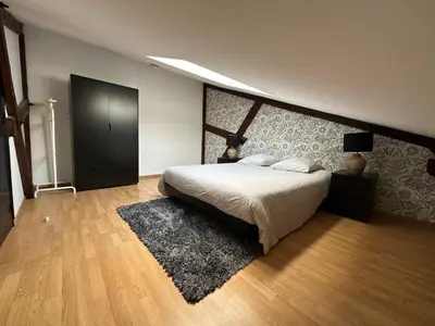 Un ou plusieurs lits dans un hébergement de l'établissement Champagne BNB - Le Duplex - Le Loft - L'Atelier - Le Cosy