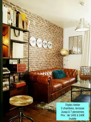 Coin salon dans l'établissement Les Appartements de Champagne