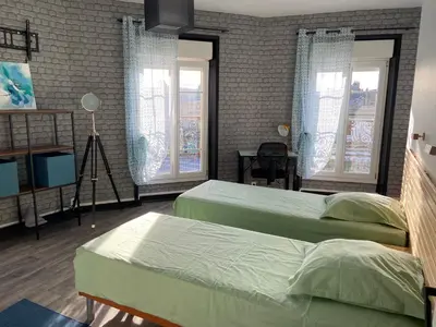 Un ou plusieurs lits dans un hébergement de l'établissement Maison de ville au centre de Fismes