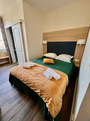 Un ou plusieurs lits dans un hébergement de l'établissement Armor Hotel