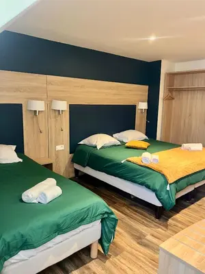 Un ou plusieurs lits dans un hébergement de l'établissement Armor Hotel
