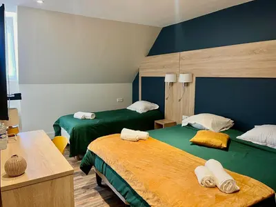 Un ou plusieurs lits dans un hébergement de l'établissement Armor Hotel