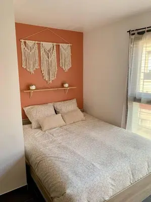 Un ou plusieurs lits dans un hébergement de l'établissement Studio chaleureux centre-ville