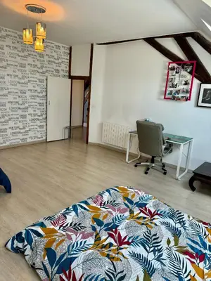 Un ou plusieurs lits dans un hébergement de l'établissement maison cosy et chic