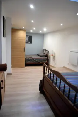 Un ou plusieurs lits dans un hébergement de l'établissement Les Gîtes de Monthermé L'Appartement belvédère sur Monthermé