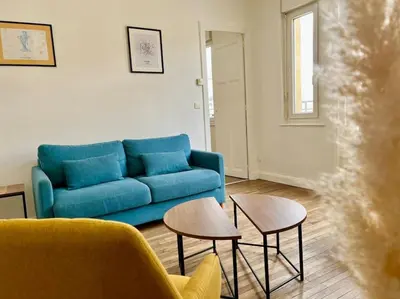 Coin salon dans l'établissement Suite Montoison Reims