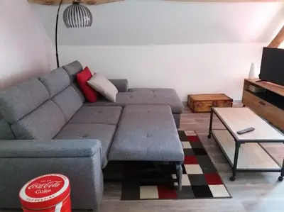 Coin salon dans l'établissement Gîte la Grange