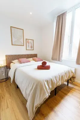 Un ou plusieurs lits dans un hébergement de l'établissement Studio Relax 2pers wifi