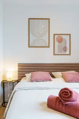 Un ou plusieurs lits dans un hébergement de l'établissement Studio Relax 2pers wifi