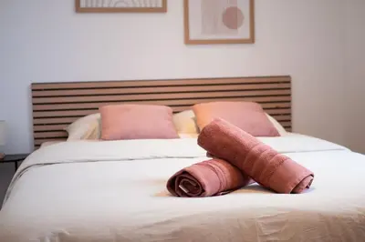 Un ou plusieurs lits dans un hébergement de l'établissement Studio Relax 2pers wifi