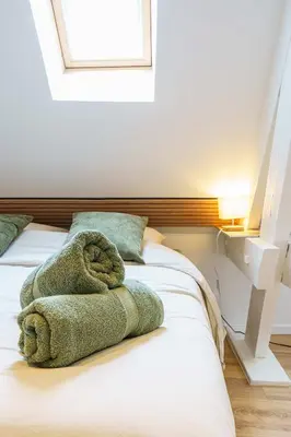 Un ou plusieurs lits dans un hébergement de l'établissement Studio Chaleureux 2 pers wifi