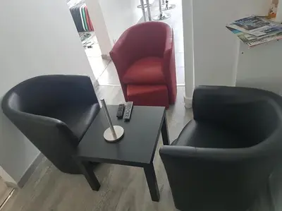 Coin salon dans l'établissement Shiny Compiègne Logement Entier