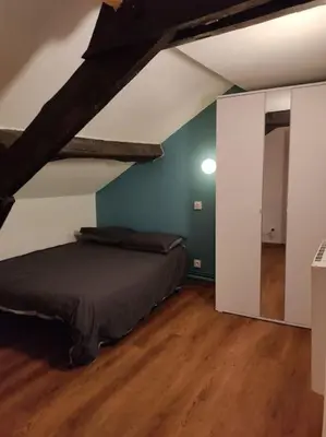 Un ou plusieurs lits dans un hébergement de l'établissement Studio Rémois - WIFI/Netflix