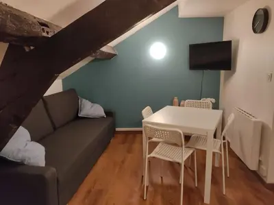 Coin salon dans l'établissement Studio Rémois - WIFI/Netflix