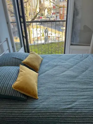 Un ou plusieurs lits dans un hébergement de l'établissement Grand Appartement le Saint Marceaux Reims centre
